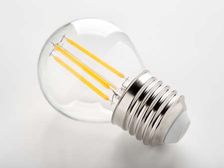 LED filament light bulb on a white bckgroundの写真素材