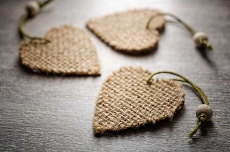 Christmas decoration of heart form on a white wooden backgroundの写真素材