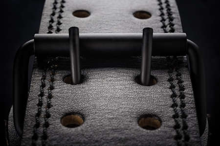 Leather belt with a buckle closeup