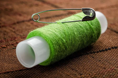 Reel of thread and pin for sewing and needleworkの写真素材