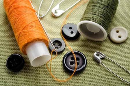Reel of thread, buttons and pins for sewing and needleworkの写真素材