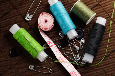 Reel of thread, buttons and pins for sewing and needleworkの写真素材