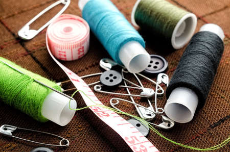 Reel of thread, buttons and pins for sewing and needleworkの写真素材