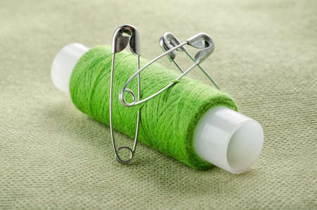 Reel of thread and pins for sewing and needleworkの写真素材