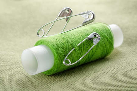 Reel of thread and pins for sewing and needleworkの写真素材