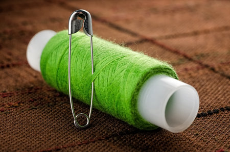 Reel of thread and pin for sewing and needleworkの写真素材