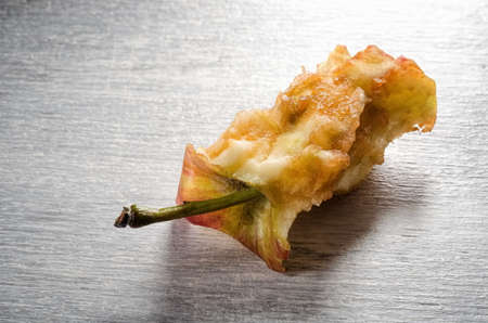 Close-up of a eaten stub appleの写真素材