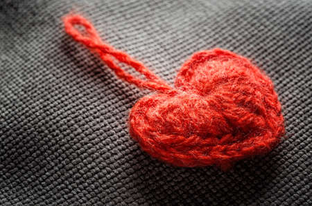 Valentine's Day red heart on fabric clothの写真素材