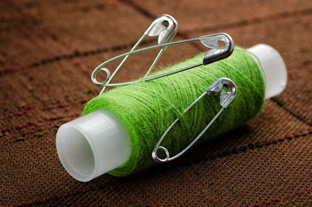 Reel of thread and pins for sewing and needleworkの写真素材