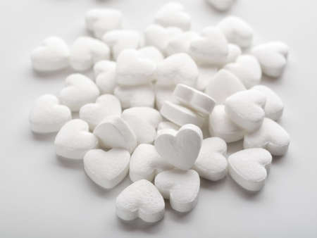 Pills as a heart form on white closeupの写真素材