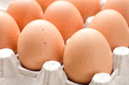 Hen eggs in paper tray close-upの写真素材