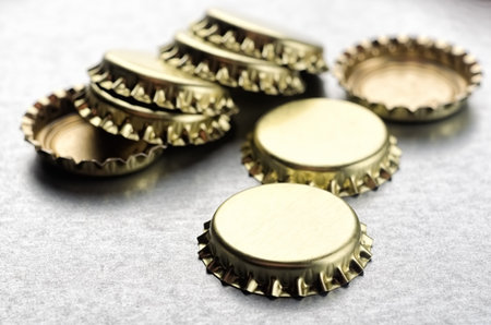Crown corks of beer bottle close-up on metallic backgroundの写真素材