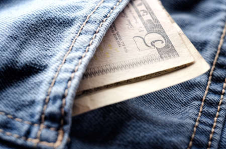 Five dollars in pocket denim pantsの写真素材