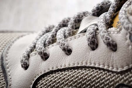 Shoelaces close-up on leather sneakersの写真素材