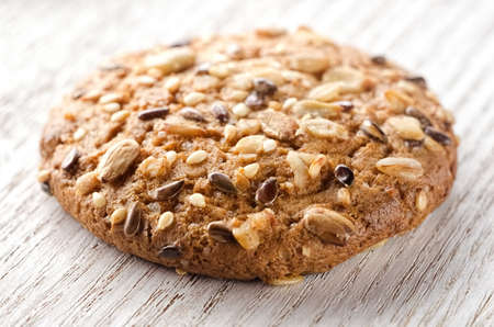 Oat cookie single on white tableの写真素材