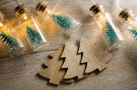 Christmas tree in glass jar glowing.