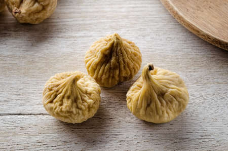 Dried figs on wooden tableの写真素材
