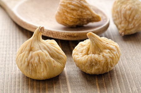 Dried figs on wooden tableの写真素材