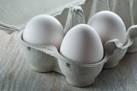 White eggs in paper tray close-upの写真素材