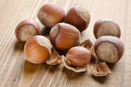 Hazelnut group closeup on a black backgroundの写真素材