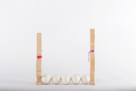 Easter bunnies and white eggs on white background