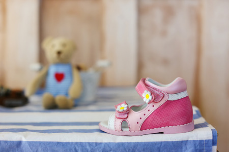 Baby Shoes. Pink baby shoes on white blue .の写真素材