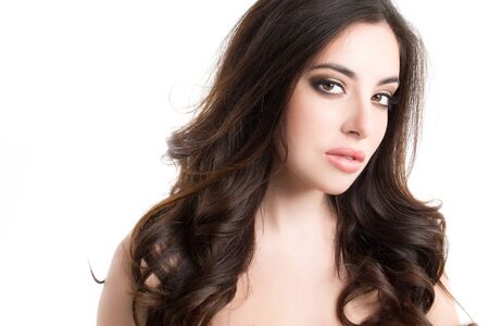 Young beautiful fashionable woman. Portrait of brunette isolated on white background. Beauty, fashion, style, hair, makeup.の写真素材