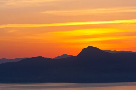 sunsen over mountainsの写真素材