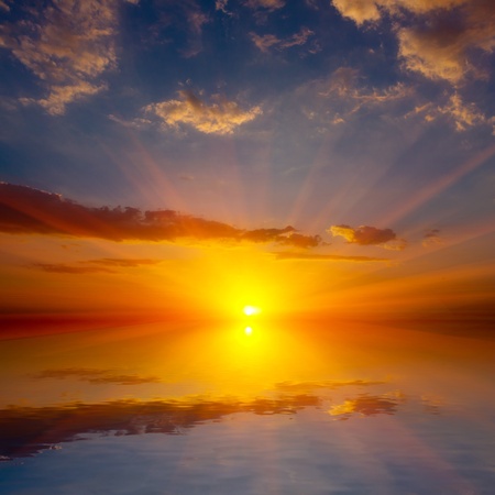 Nice sunset over water surafceの写真素材