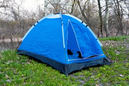 blue tent in spring forestの写真素材
