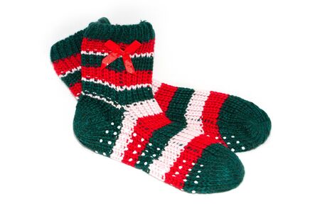 child's knited socks on white backgroundの写真素材