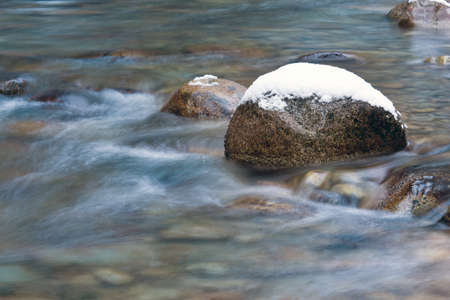 Winter scene on mountain riverの写真素材