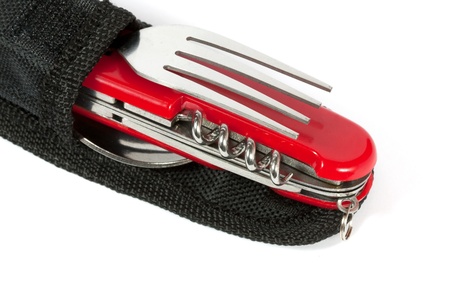 Red multipurpose knife with fork in caseの写真素材