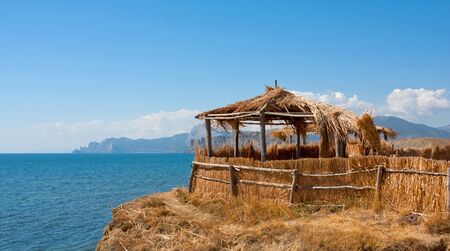 cane shelter on seaside in Crimeaの写真素材