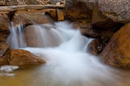 Nice mountain stream among stonesの写真素材