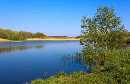 Blue lake under blue skyの写真素材
