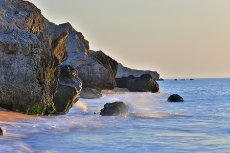 Stone on seasshore in evening timeの写真素材