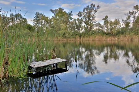 nice day near fishing place on river の写真素材