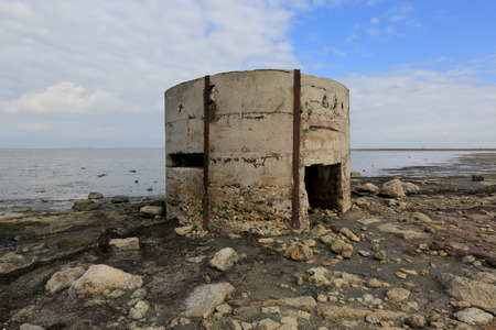 Old abandoned military bunker on seashoreの写真素材