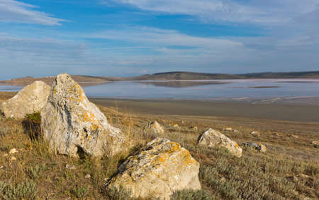 Landscape with stones and salt sea on backgroundの写真素材