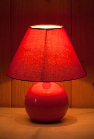 table lamp on wooden wall background の写真素材