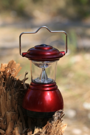 red camp lanterm on woodsの写真素材