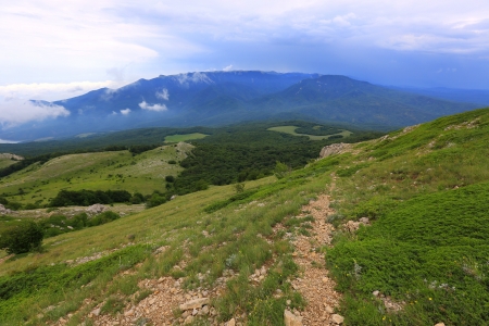 landscape with pathway in mountainsの写真素材