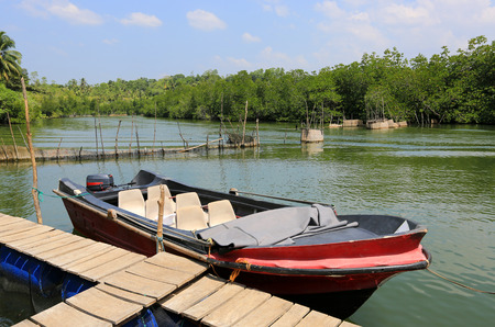 motor boat on river near moorageの写真素材