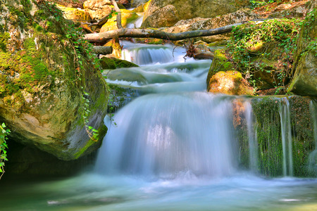 Landscape with Nice small waterfall on mountain riverの写真素材