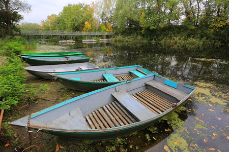 Boats on moorage at autumn timeの写真素材