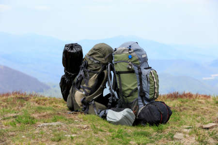 two backpack's tourist's equipment on meadow in mountains の写真素材