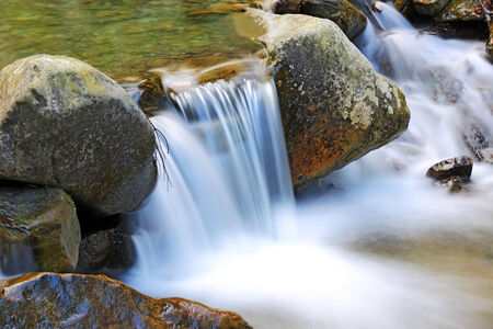 Nice mountain stream among stonesの写真素材