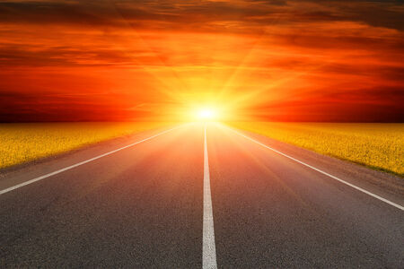 Empty asphalt road to sunsetの写真素材