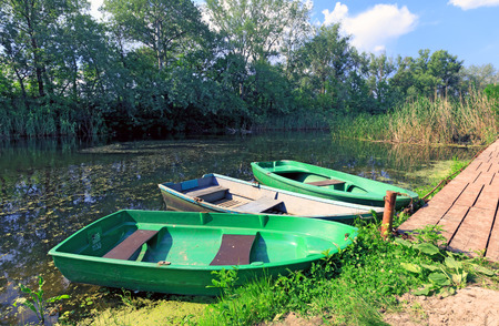 Boats on moorage at summer time の写真素材